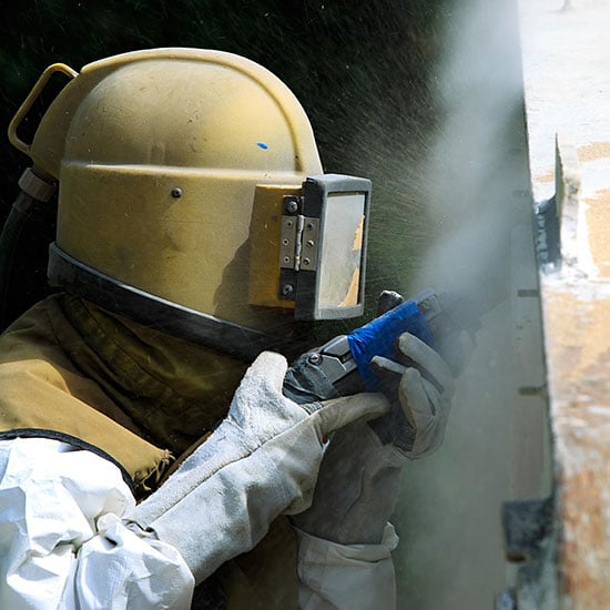using a sandblasting gun
